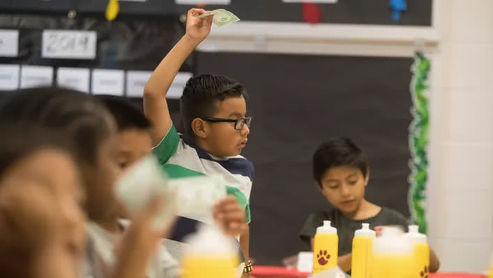 Child Holding Money